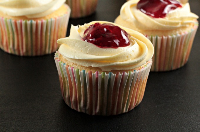 Strawberry Cheesecake Cupcakes transform a boxed white cake mix into a delicious treat with premade cheesecake filling and strawberry pie filling. So easy!