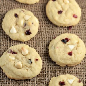 White Chocolate Chip Craisin Cookies feature sugar cookie dough with creamy white chocolate chipsand tart, sweet craisins. A delicious and satisfying treat!