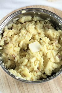 Asiago Garlic Mashed Potatoes combine red potatoes, authentic cheese, garlic, butter, milk, salt and pepper to make an easy and delicious side dish.