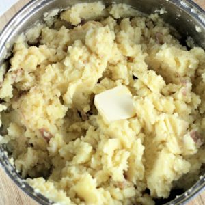 Asiago Garlic Mashed Potatoes combine red potatoes, authentic cheese, garlic, butter, milk, salt and pepper to make an easy and delicious side dish.