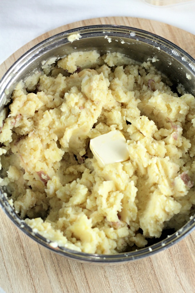 Asiago Garlic Mashed Potatoes combine red potatoes, authentic cheese, garlic, butter, milk, salt and pepper to make an easy and delicious side dish. 