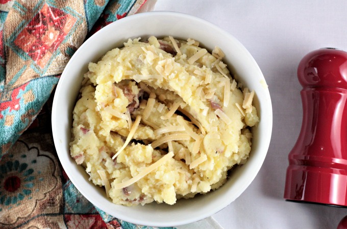 Asiago Garlic Mashed Potatoes combine red potatoes, authentic cheese, garlic, butter, milk, salt and pepper to make an easy and delicious side dish. 