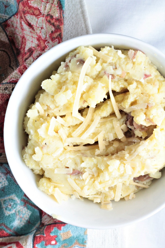 Asiago Garlic Mashed Potatoes combine red potatoes, authentic cheese, garlic, butter, milk, salt and pepper to make an easy and delicious side dish. 