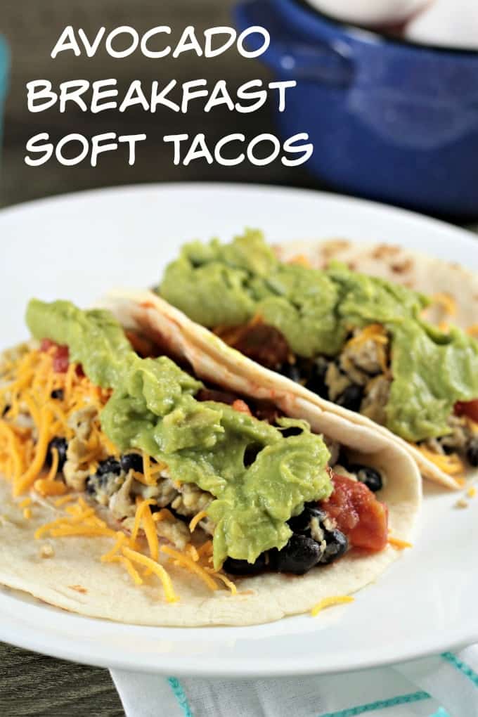 Avocado Breakfast Soft Tacos-scrambled eggs, black beans, cheese, salsa, and avocado atop a warm flour tortilla, perfect breakfast, brunch, lunch or dinner!
