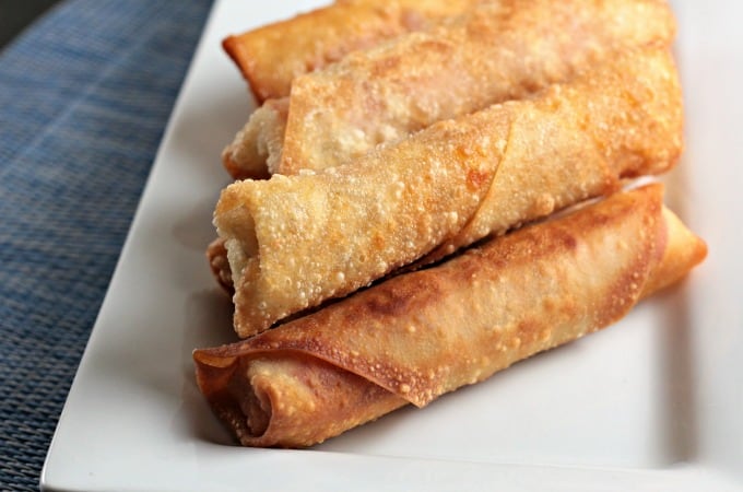 Pepperoni Pizza Egg Rolls feature mozzarella string cheese, sliced pepperoni and Italian seasoning wrapped in an egg roll wrapper and the deep fried to perfection. This is an easy and fun appetizer or snack great for kids and adults alike. Mindy's Cooking Obsession