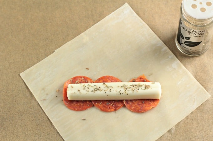 Pepperoni Pizza Egg Rolls feature mozzarella string cheese, sliced pepperoni and Italian seasoning wrapped in an egg roll wrapper and the deep fried to perfection. This is an easy and fun appetizer or snack great for kids and adults alike. Mindy's Cooking Obsession