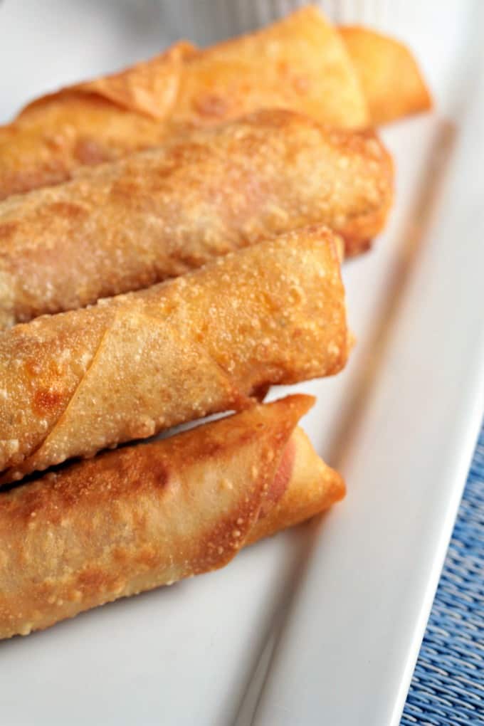 Pepperoni Pizza Egg Rolls feature mozzarella string cheese, sliced pepperoni and Italian seasoning wrapped in an egg roll wrapper and the deep fried to perfection. This is an easy and fun appetizer or snack great for kids and adults alike. Mindy's Cooking Obsession