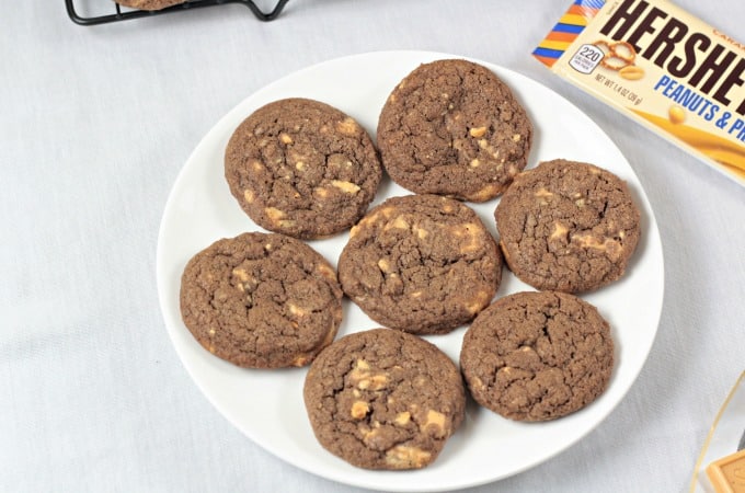 Chocolate Hershey's Gold Cookies - A classic thin and chewy chocolate cookie with chunks of new Hershey's Gold candy bar (caramelzed creme, pretzels and peanuts). Made with flour, granulated and light brown sugar, eggs, cocoa, vanilla, baking soda and salt. Makes nearly 5 dozen cookies!