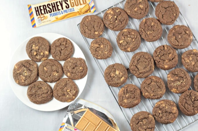 Chocolate Hershey's Gold Cookies - A classic thin and chewy chocolate cookie with chunks of new Hershey's Gold candy bar (caramelzed creme, pretzels and peanuts). Made with flour, granulated and light brown sugar, eggs, cocoa, vanilla, baking soda and salt. Makes nearly 5 dozen cookies!