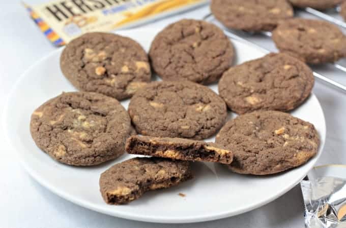 Chocolate Hershey's Gold Cookies - A classic thin and chewy chocolate cookie with chunks of new Hershey's Gold candy bar (caramelzed creme, pretzels and peanuts). Made with flour, granulated and light brown sugar, eggs, cocoa, vanilla, baking soda and salt. Makes nearly 5 dozen cookies!