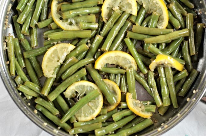 Garlic Lemon Fresh Green Beans only require 6 ingredients and only take about 8 minutes to cook. Blanch green beans in a little water, drain, then pan fry with olive oil, garlic, salt, pepper and lemon. A healthy, quick, easy and impressive dish!