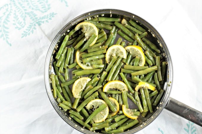 Garlic Lemon Fresh Green Beans only require 6 ingredients and only take about 8 minutes to cook. Blanch green beans in a little water, drain, then pan fry with olive oil, garlic, salt, pepper and lemon. A healthy, quick, easy and impressive dish!