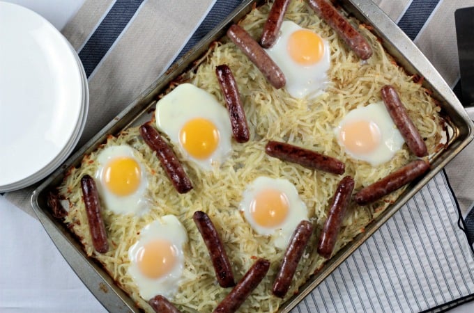 Sausage Sheet Pan Breakfast features store bought hash browns, link sausage, and eggs seasoned with salt and pepper and a splash of melted butter. It is an easy and delicious breakfast, brunch or dinner cooked on one sheet pan. And, clean up is a breeze!