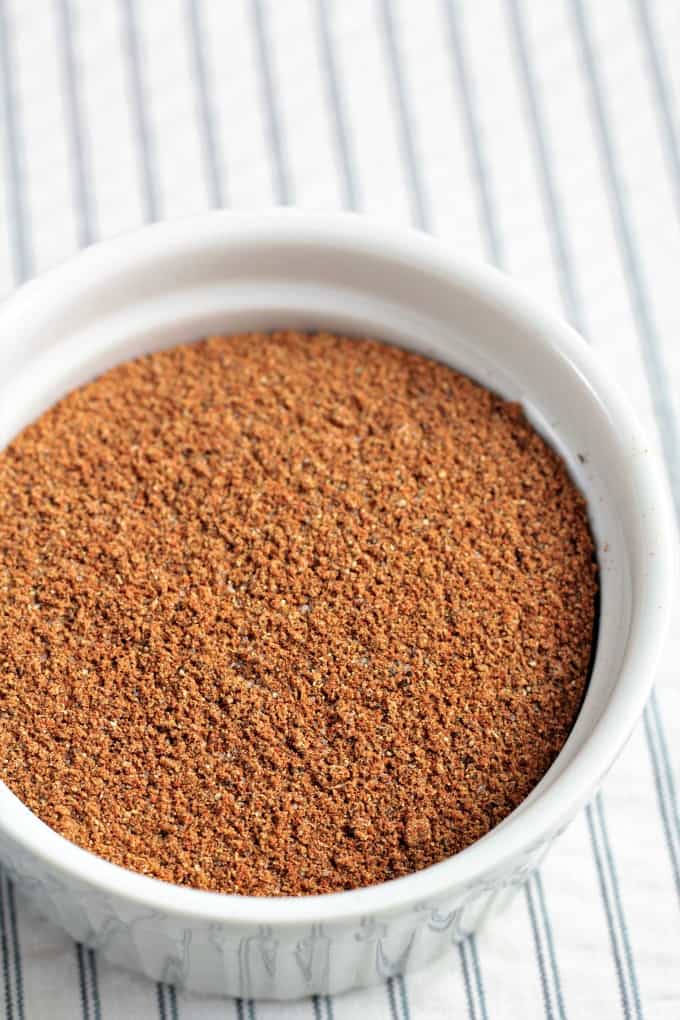 Moroccan Spice Blend is a mixture of ground ginger, paprika, cumin, cinnamon, coriander, cayenne pepper, allspice, cloves, salt and black pepper. This spice blend is much like Ras El Hanout. It is pungent and warm and is fabulous and can be used for rubs, marinades, or to season stews and tajines.