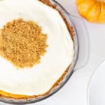 Pumpkin Cream Cheese Pie is an old fashioned recipe featuring canned pumpkin and cream cheese in a graham cracker crust topped with a sweetened sour cream.