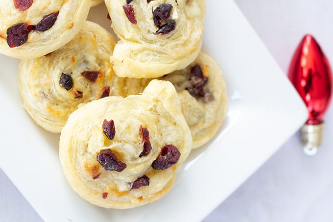 Dried Cranberry Brie Pinwheels: combine puff pastry, craisins and cheese for an easy and impressive appetizer or party food perfect for entertaining. 