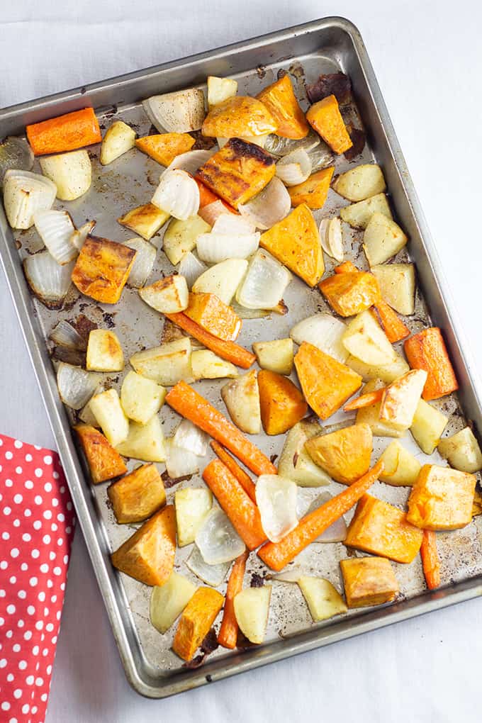 Roasted Root Vegetables feature Russet, sweet potatoes, carrot and onion seasoned with salt, pepper and drizzled with olive oil then roasted to perfection. 