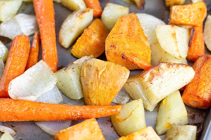 Roasted Root Vegetables feature Russet, sweet potatoes, carrot and onion seasoned with salt, pepper and drizzled with olive oil then roasted to perfection. 