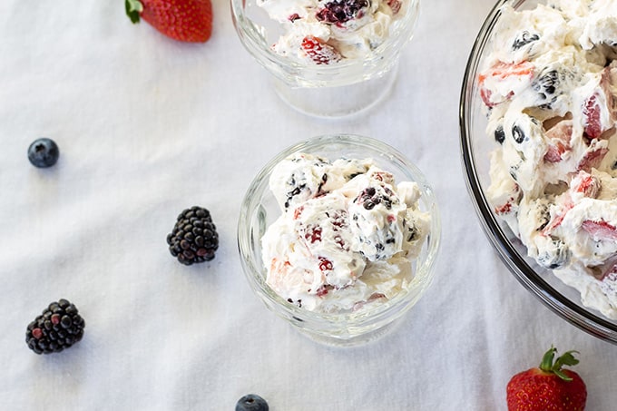 Triple Berry Cheesecake Salad features cream cheese, whipped topping, a little sugar, and plump juicy strawberries, blueberries, and blackberries!