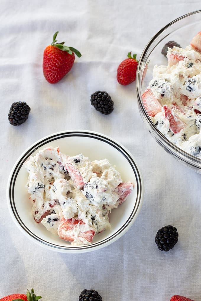 Triple Berry Cheesecake Salad features cream cheese, whipped topping, a little sugar, and plump juicy strawberries, blueberries, and blackberries!