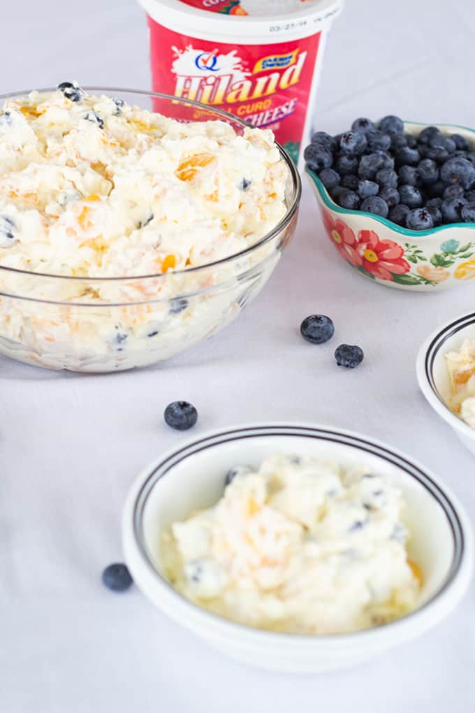 Peach Blueberry Fluff Salad features canned peaches, fresh blueberries, vanilla pudding, cottage cheese and whipped topping. A healthier dessert recipe.