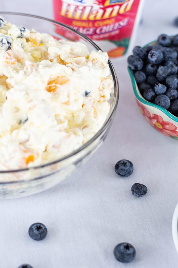 Peach Blueberry Fluff Salad features canned peaches, fresh blueberries, vanilla pudding, cottage cheese and whipped topping. A healthier dessert recipe.