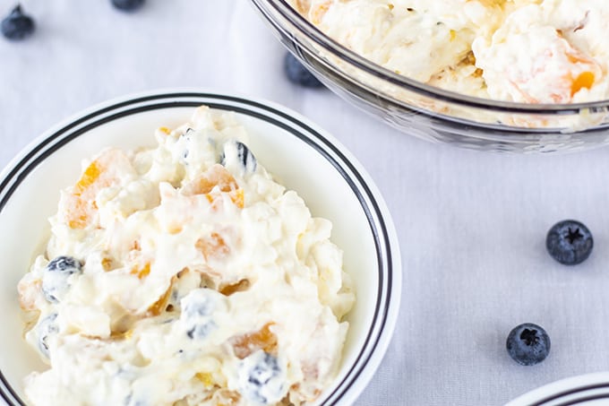 Peach Blueberry Fluff Salad features canned peaches, fresh blueberries, vanilla pudding, cottage cheese and whipped topping. A healthier dessert recipe.