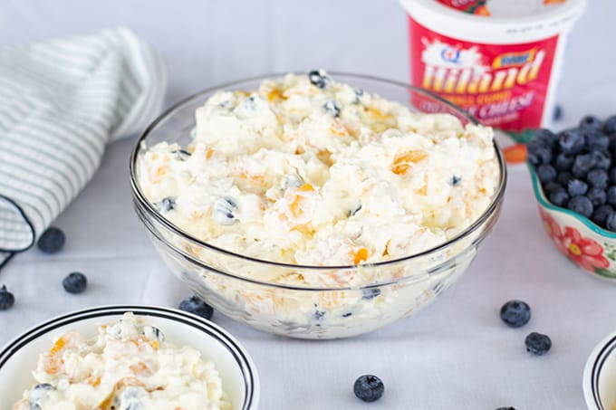 Peach Blueberry Fluff Salad features canned peaches, fresh blueberries, vanilla pudding, cottage cheese and whipped topping. A healthier dessert recipe.