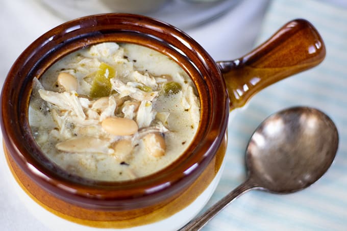 Creamy White Chicken Chili combines chicken, white beans, green chiles, broth, sour cream and spices to make a quick and comforting dish. 