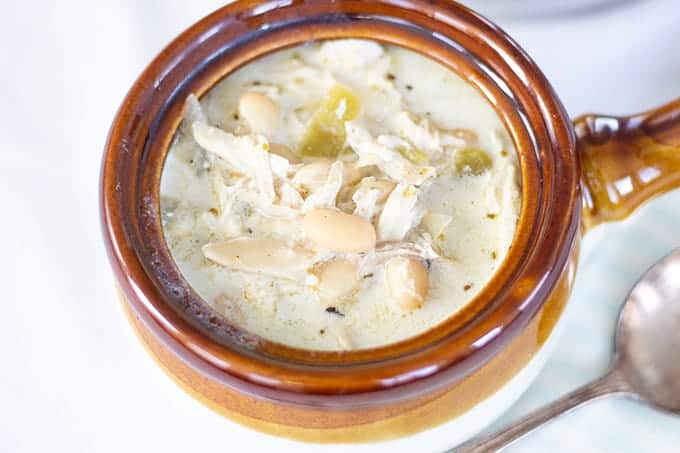 Creamy White Chicken Chili combines chicken, white beans, green chiles, broth, sour cream and spices to make a quick and comforting dish.