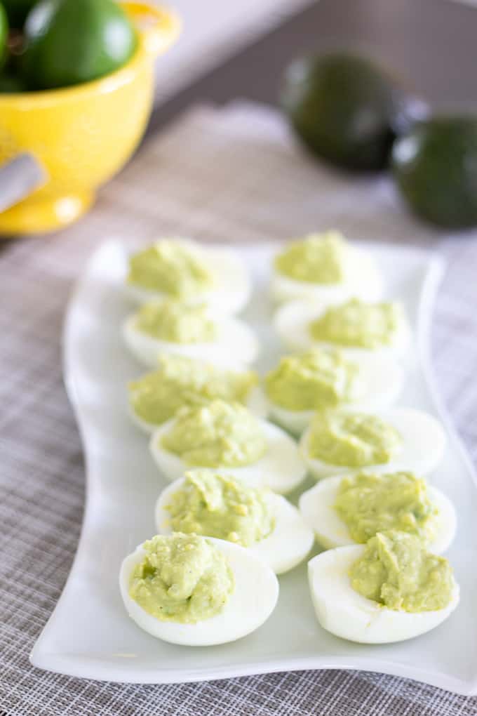 Avocado Ranch Deviled Eggs are a modern take on classic deviled eggs featuring avocado, ranch dressing, and a splash of lime. Easy and kid-friendly!