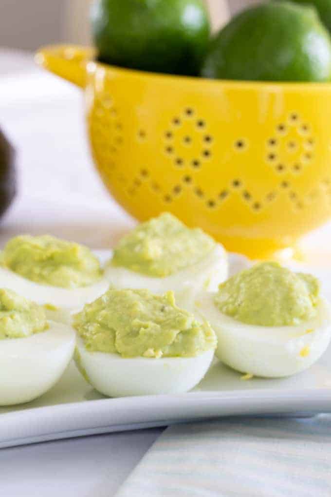 Avocado Ranch Deviled Eggs are a modern take on classic deviled eggs featuring avocado, ranch dressing, and a splash of lime. Easy and kid-friendly!