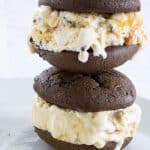 Mini Ice Cream Sandwiches are soft chocolate cookies filled with ice cream that has chocolate chunks and swirls of sea salt caramel to make a yummy dessert!