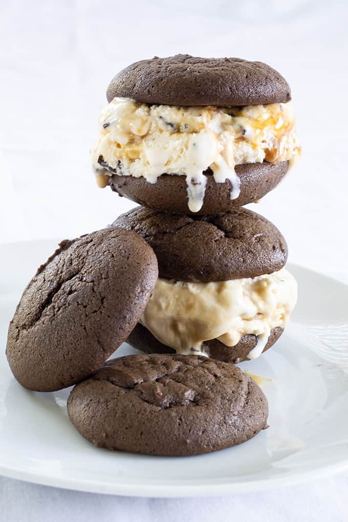 Mini Ice Cream Sandwiches are soft chocolate cookies filled with ice cream that has chocolate chunks and swirls of sea salt caramel to make a yummy dessert!