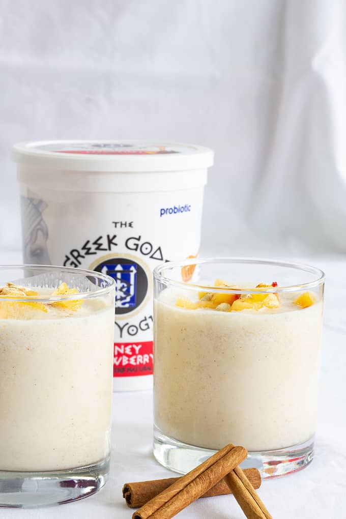 Peach Strawberry Oatmeal Smoothie combines greek yogurt, frozen peaches, milk, oatmeal, honey, cinnamon, vanilla and ice to make a healthy and beverage! 