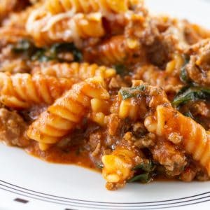 One Pot Beefy Pasta features ground beef, jar sauce and fresh spinach. It is as fast and easy as the popular boxed dinners and better for you!