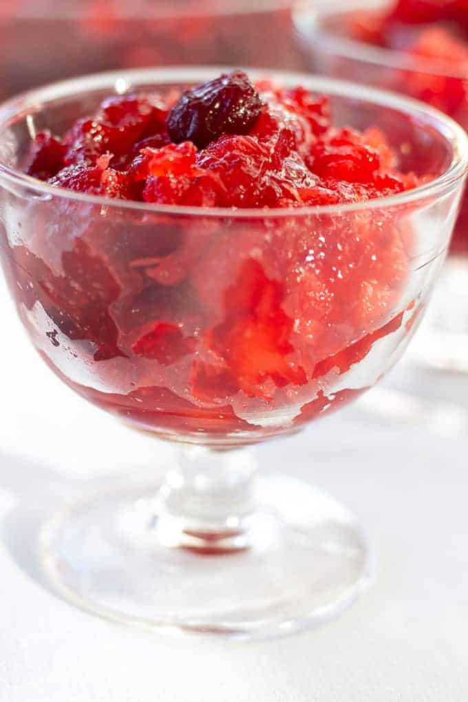 Cranberry Pineapple Jello Salad features whole berry cranberry sauce, crushed pineapple, and raspberry jello. A tasty way to perk up canned cranberry sauce.