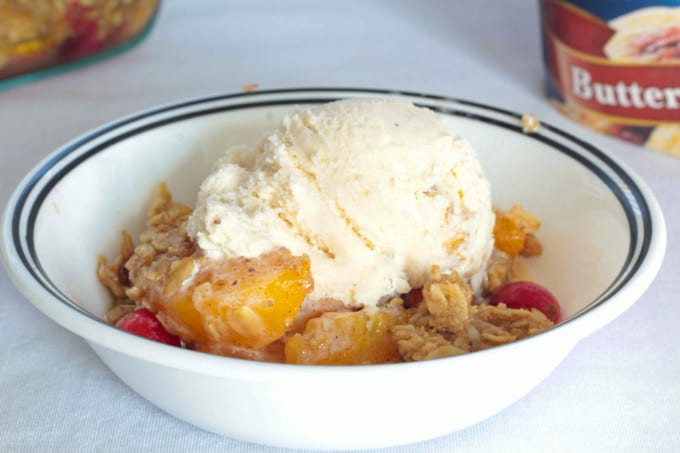 Simple Peach Cranberry Crumble features canned peaches and fresh cranberries, topped with a wholesome spiced cinnamon oat crumble and baked to perfection!