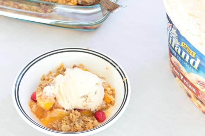 Simple Peach Cranberry Crumble features canned peaches and fresh cranberries, topped with a wholesome spiced cinnamon oat crumble and baked to perfection!