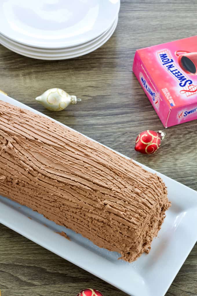 Chocolate Yule Log features chocolate sponge cake filled with cream cheese frosting adn topped with a chocolate frosting. Lightened up with Sweet'N Low. 