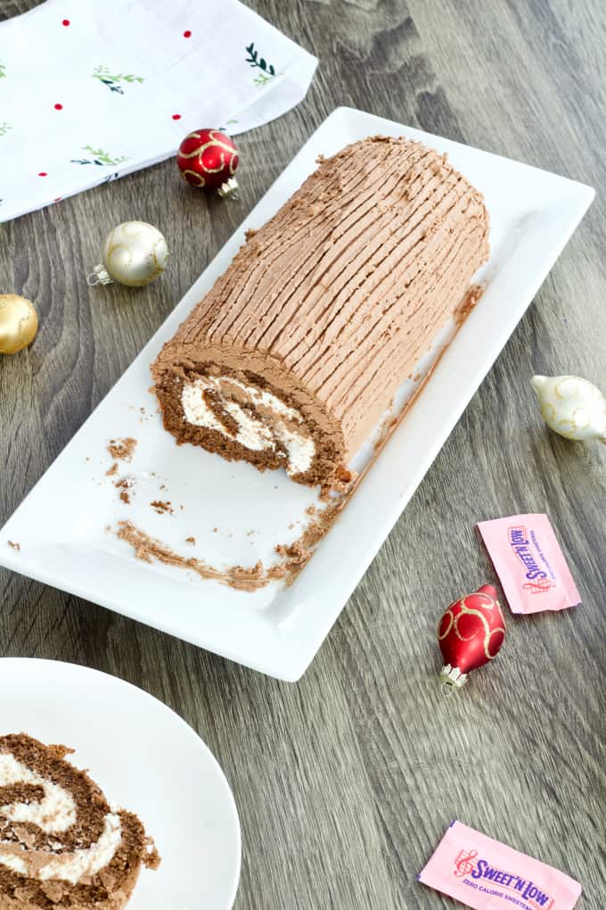Chocolate Yule Log features chocolate sponge cake filled with cream cheese frosting adn topped with a chocolate frosting. Lightened up with Sweet'N Low. 