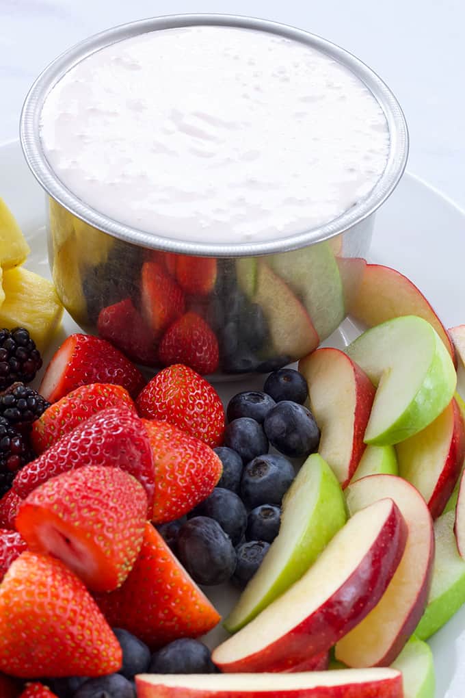 Heavenly Party Fruit Dip combines just 3 ingredients, Greek yogurt, cream cheese, and marshmallow cream to make this tasty dip that is perfect for fruit. 