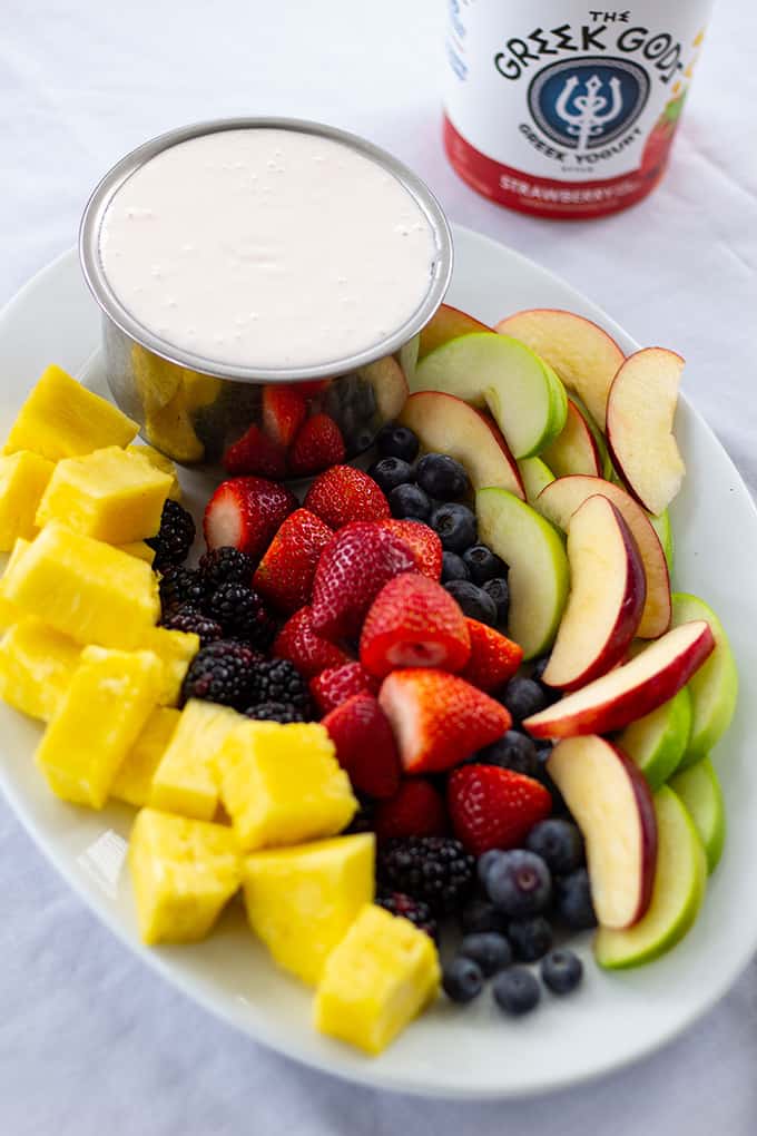 Heavenly Party Fruit Dip combines just 3 ingredients, Greek yogurt, cream cheese, and marshmallow cream to make this tasty dip that is perfect for fruit. 