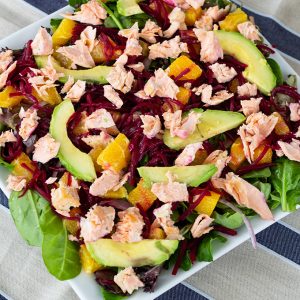 Salmon Beet & Orange Salad is served on a bed of spring salad mix and topped with an easy honey mustard vinaigrette to make a light and healthy meal.