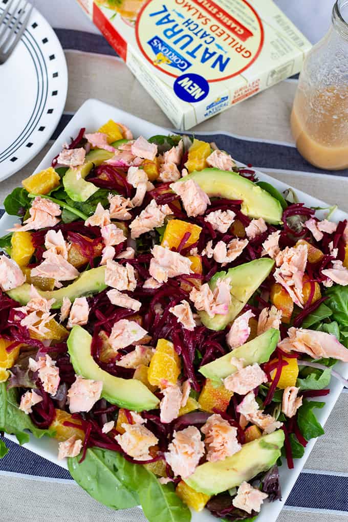 Salmon Beet & Orange Salad is served on a bed of spring salad mix and topped with an easy honey mustard vinaigrette to make a light and healthy meal. 