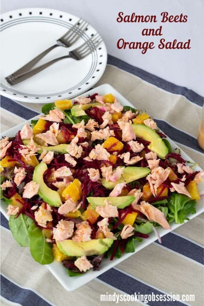 Salmon Beet & Orange Salad is served on a bed of spring salad mix and topped with an easy honey mustard vinaigrette to make a light and healthy meal. 