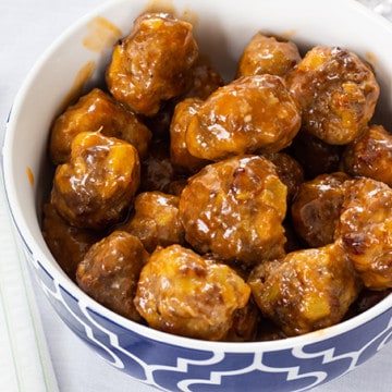 Made with sausage and beef, Sausage Pineapple Mini Meatballs are an easy to make show-stopping tangy and zesty appetizer perfect for a party or game day.