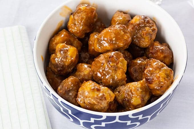 Made with sausage and beef, Sausage Pineapple Mini Meatballs are an easy to make show-stopping tangy and zesty appetizer perfect for a party or game day. 