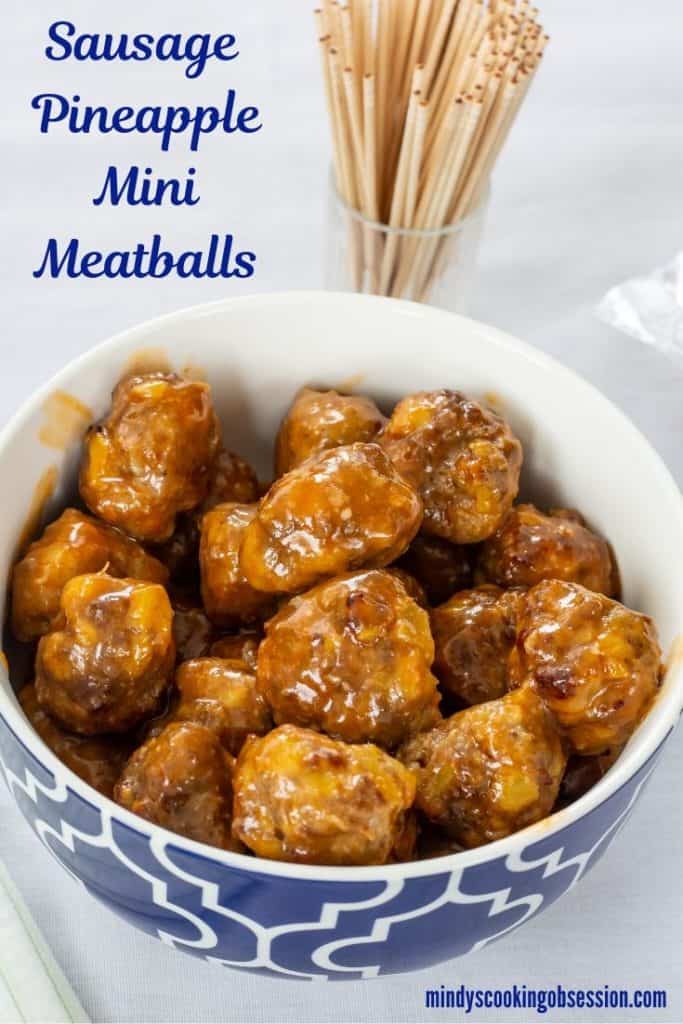 Made with sausage and beef, Sausage Pineapple Mini Meatballs are an easy to make show-stopping tangy and zesty appetizer perfect for a party or game day. 