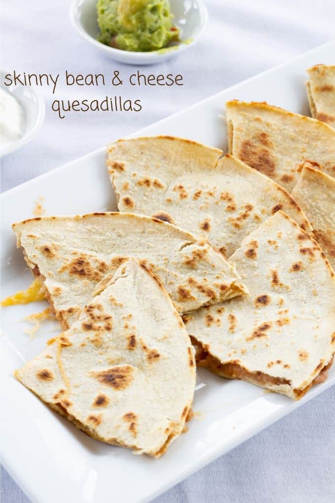 Skinny Bean & Cheese Quesadillas feature refried beans and cheese. They are made with a low fat CAULIPOWER cauliflower tortilla, making them good for you!